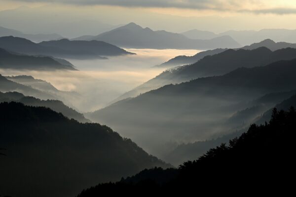 mountains with clouds in the valley