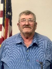 Bob - our County Board Representative in a blue checkered shirt by the American flag