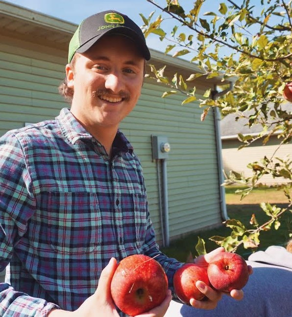 Joey holding freshly picked apples